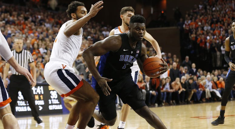 Duke Blue Devils forward Zion Williamson (1) drives to the basket as Virginia Cavaliers guard Braxton Key (2) defends in the first half at John Paul Jones Arena. The Blue Devils won 81-71. Duke Blue Devils forward Zion Williamson (1) drives to the basket as Virginia Cavaliers guard Braxton Key (2) defends in the first half at John Paul Jones Arena. The Blue Devils won 81-71.