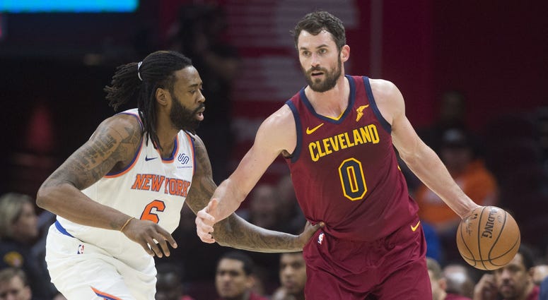 New York Knicks center DeAndre Jordan (6) guards Cleveland Cavaliers forward Kevin Love (0) during the first half at Quicken Loans Arena.