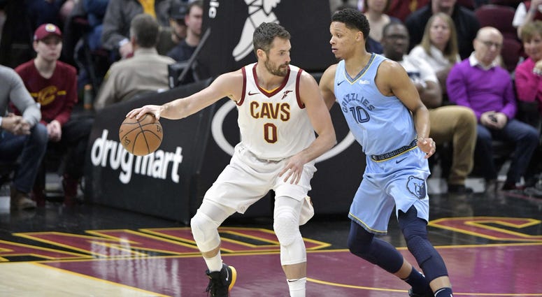 Feb 23, 2019; Cleveland, OH, USA; Cleveland Cavaliers forward Kevin Love (0) dribbles against Memphis Grizzlies forward Ivan Rabb (10) in the first quarter at Quicken Loans Arena. Mandatory Credit: David Richard-USA TODAY Sports Feb 23, 2019; Cleveland, OH, USA; Cleveland Cavaliers forward Kevin Love (0) dribbles against Memphis Grizzlies forward Ivan Rabb (10) in the first quarter at Quicken Loans Arena. Mandatory Credit: David Richard-USA TODAY Sports