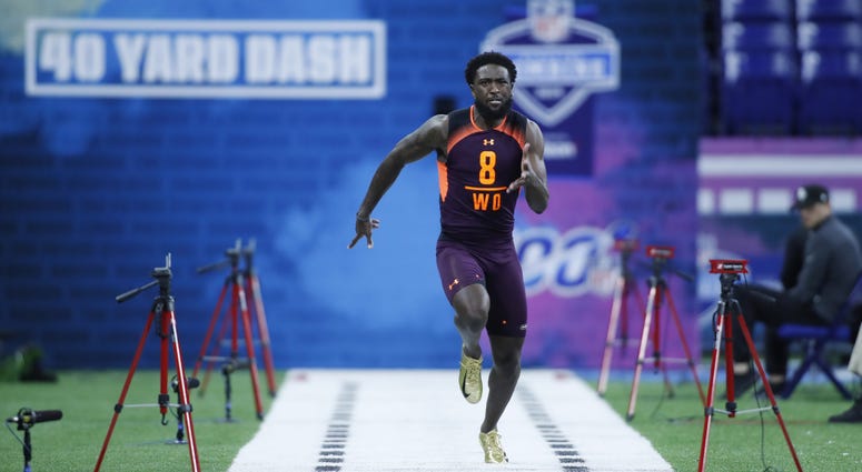 Ohio State wide receiver Parris Campbell (WO08) runs the 40 yard dash during the 2019 NFL Combine at Lucas Oil Stadium.