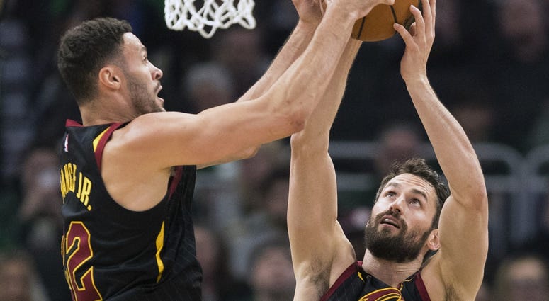 Cleveland Cavaliers forward Larry Nance Jr. (22) and forward Kevin Love (0) reach for a rebound during the first quarter against the Milwaukee Bucks at Fiserv Forum. Cleveland Cavaliers forward Larry Nance Jr. (22) and forward Kevin Love (0) reach for a rebound during the first quarter against the Milwaukee Bucks at Fiserv Forum.