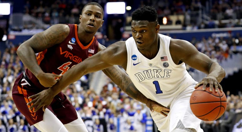 Duke Blue Devils forward Zion Williamson (1) drives to the basket against Virginia Tech Hokies guard Ty Outlaw (42) during the first half in the semifinals of the east regional of the 2019 NCAA Tournament at Capital One Arena. Duke Blue Devils forward Zion Williamson (1) drives to the basket against Virginia Tech Hokies guard Ty Outlaw (42) during the first half in the semifinals of the east regional of the 2019 NCAA Tournament at Capital One Arena.