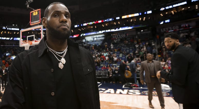 New Orleans Pelicans forward Anthony Davis looks back at Los Angeles Lakers forward LeBron James following a game at the Smoothie King Center. New Orleans Pelicans forward Anthony Davis looks back at Los Angeles Lakers forward LeBron James following a game at the Smoothie King Center.