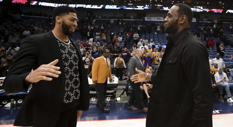 New Orleans Pelicans forward Anthony Davis meets with Los Angeles Lakers forward LeBron James following a game at the Smoothie King Center. New Orleans Pelicans forward Anthony Davis meets with Los Angeles Lakers forward LeBron James following a game at the Smoothie King Center.