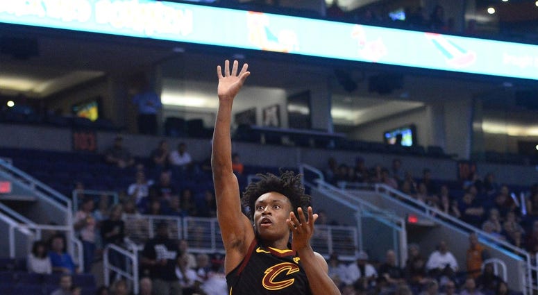 Cleveland Cavaliers guard Collin Sexton (2) shoots over Phoenix Suns forward Richaun Holmes (21) during the first half at Talking Stick Resort Arena. Cleveland Cavaliers guard Collin Sexton (2) shoots over Phoenix Suns forward Richaun Holmes (21) during the first half at Talking Stick Resort Arena.