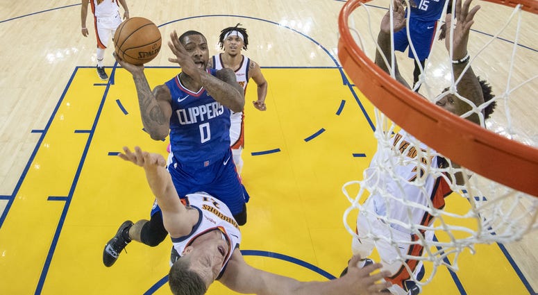 April 7, 2019; Oakland, CA, USA; LA Clippers guard Sindarius Thornwell (0) shoots the basketball against Golden State Warriors forward Jonas Jerebko (21) during the second half at Oracle Arena. Mandatory Credit: April 7, 2019; Oakland, CA, USA; LA Clipper April 7, 2019; Oakland, CA, USA; LA Clippers guard Sindarius Thornwell (0) shoots the basketball against Golden State Warriors forward Jonas Jerebko (21) during the second half at Oracle Arena. Mandatory Credit: Kyle Terada-USA TODAY Sports