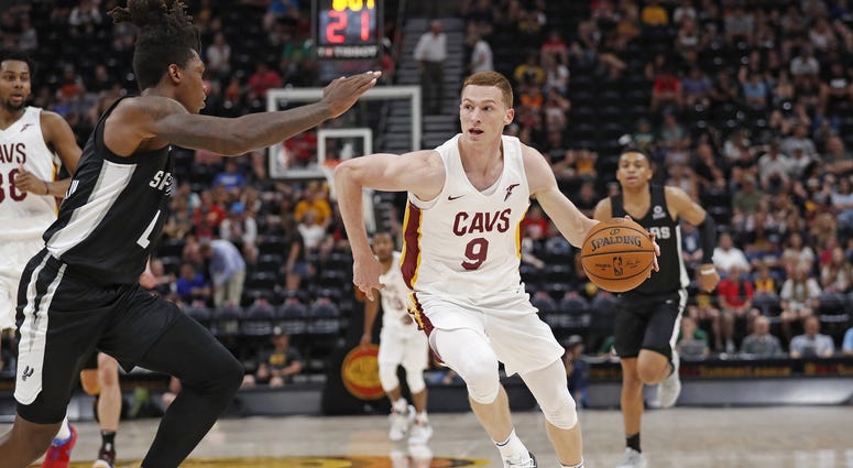 Jul 1, 2019; Salt Lake City, UT, USA; Cleveland Cavaliers Dylan Windler (9) drives against San Antonio Spurs Lonnie Walker IV (1) in the third quarter at Vivint Smart Home Arena. Mandatory Credit: Jeff Swinger-USA TODAY Sports Jul 1, 2019; Salt Lake City, UT, USA; Cleveland Cavaliers Dylan Windler (9) drives against San Antonio Spurs Lonnie Walker IV (1) in the third quarter at Vivint Smart Home Arena. Mandatory Credit: Jeff Swinger-USA TODAY Sports