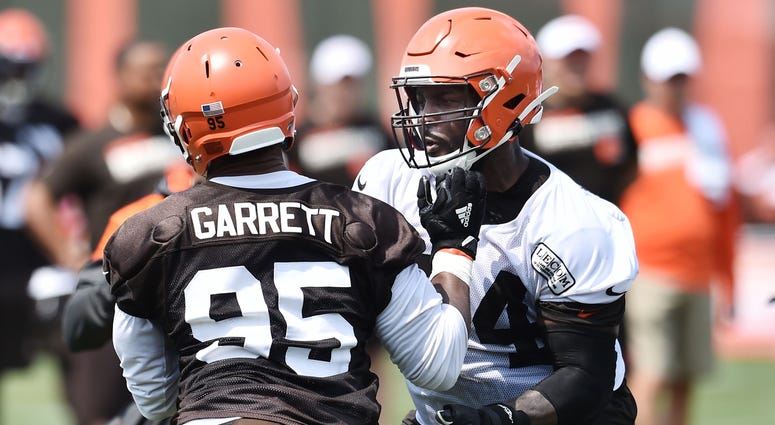 Cleveland Browns defensive end Myles Garrett (95) rushes against offensive tackle Chris Hubbard (74) during training camp at the Cleveland Browns Training Complex. Cleveland Browns defensive end Myles Garrett (95) rushes against offensive tackle Chris Hubbard (74) during training camp at the Cleveland Browns Training Complex.