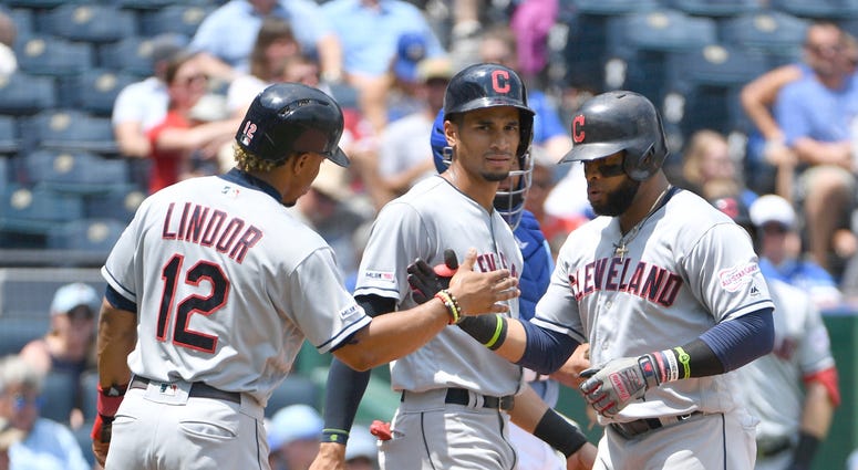 Jul 28, 2019; Kansas City, MO, USA; Cleveland Indians designated hitter Carlos Santana (41) is congratulated by shortstop Francisco Lindor (12) after scoring against the Kansas City Royals in the first inning at Kauffman Stadium. Mandatory Credit: Denny M Jul 28, 2019; Kansas City, MO, USA; Cleveland Indians designated hitter Carlos Santana (41) is congratulated by shortstop Francisco Lindor (12) after scoring against the Kansas City Royals in the first inning at Kauffman Stadium. Mandatory Credit: Denny M
