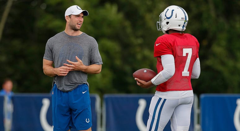Indianapolis Colts quarterback Andrew Luck (12) with his left ankle tapped watches quarterback Jacoby Brissett (7) during their preseason training camp practice at Grand Park in Westfield on Wednesday, August 14, 2019. Colts Preseason Training Camp Indianapolis Colts quarterback Andrew Luck (12) with his left ankle tapped watches quarterback Jacoby Brissett (7) during their preseason training camp practice at Grand Park in Westfield on Wednesday, August 14, 2019. Colts Preseason Training Camp