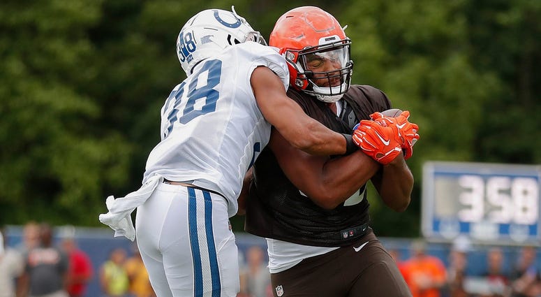 Indianapolis Colts defensive back Isaiah Johnson (38) hits Cleveland Browns tight end Rico Gathers (82) during their preseason training camp practice at Grand Park in Westfield on Wednesday, August 14, 2019. Colts Preseason Training Camp Indianapolis Colts defensive back Isaiah Johnson (38) hits Cleveland Browns tight end Rico Gathers (82) during their preseason training camp practice at Grand Park in Westfield on Wednesday, August 14, 2019. Colts Preseason Training Camp