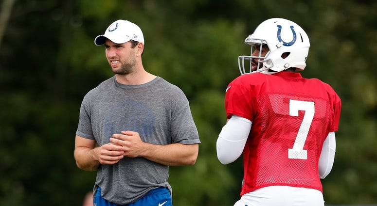 Indianapolis Colts quarterback Andrew Luck (12) with his left ankle tapped watches quarterback Jacoby Brissett (7) during their preseason training camp practice at Grand Park in Westfield on Wednesday, August 14, 2019. Colts Preseason Training Camp Indianapolis Colts quarterback Andrew Luck (12) with his left ankle tapped watches quarterback Jacoby Brissett (7) during their preseason training camp practice at Grand Park in Westfield on Wednesday, August 14, 2019. Colts Preseason Training Camp