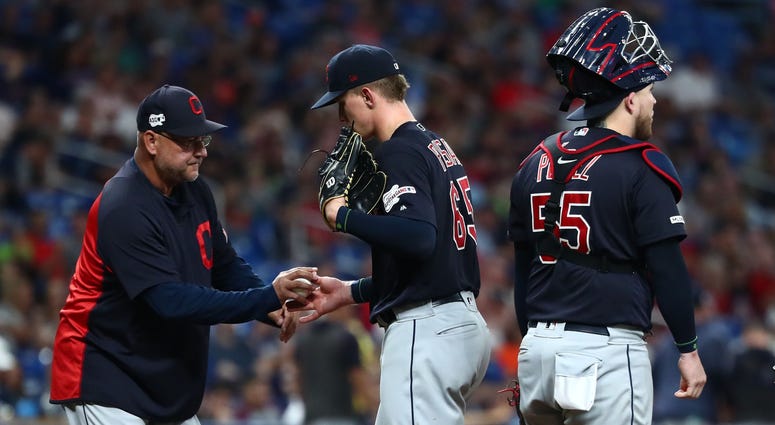 Aug 31, 2019; St. Petersburg, FL, USA;Cleveland Indians manager Terry Francona (77) takes out starting pitcher Zach Plesac (65) during the sixth inning against the Tampa Bay Rays at Tropicana Field. Cleveland Indians manager Terry Francona (77) takes out starting pitcher Zach Plesac (65) during the sixth inning against the Tampa Bay Rays at Tropicana Field.