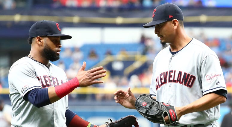 Sep 1, 2019; St. Petersburg, FL, USA; Cleveland Indians first baseman Carlos Santana (41) hugs pitcher Carlos Carrasco (59) after he pitched the seventh inning for the first time since he was diagnosed with leukemia against the Tampa Bay Rays at Tropicana Cleveland Indians first baseman Carlos Santana (left) and pitcher Carlos Carrasco (right)