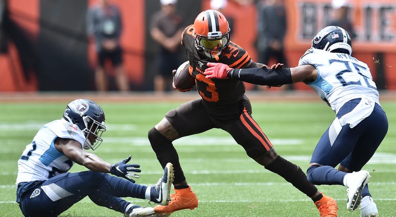 Sep 8, 2019; Cleveland, OH, USA; Cleveland Browns wide receiver Odell Beckham (13) runs with the ball after a catch as Tennessee Titans cornerback Adoree' Jackson (25) and cornerback Logan Ryan (26) defend during the first half at FirstEnergy Stadium. Man ames is signing as a free agent with the Los Angeles Lakers, leaving the Cavaliers for the second time to join one of the NBA’s most iconic franchises.Sep 8, 2019; Cleveland, OH, USA; Cleveland Browns wide receiver Odell Beckham (13) runs with the ball af