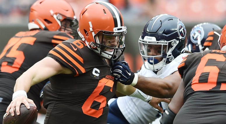 Sep 8, 2019; Cleveland, OH, USA; Tennessee Titans linebacker Sharif Finch (56) gets a hand on the shirt of Cleveland Browns quarterback Baker Mayfield (6) during the second half at FirstEnergy Stadium. Mandatory Credit: Ken Blaze-USA TODAY Sports Sep 8, 2019; Cleveland, OH, USA; Tennessee Titans linebacker Sharif Finch (56) gets a hand on the shirt of Cleveland Browns quarterback Baker Mayfield (6) during the second half at FirstEnergy Stadium. Mandatory Credit: Ken Blaze-USA TODAY Sports