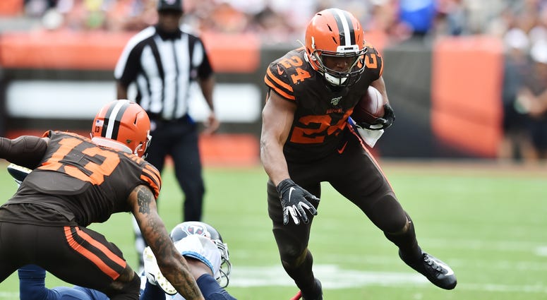 Sep 8, 2019; Cleveland, OH, USA; Cleveland Browns running back Nick Chubb (24) is tripped up by Tennessee Titans cornerback Malcolm Butler (21) during the second half at FirstEnergy Stadium. Mandatory Credit: Ken Blaze-USA TODAY Sports Sep 8, 2019; Cleveland, OH, USA; Cleveland Browns running back Nick Chubb (24) is tripped up by Tennessee Titans cornerback Malcolm Butler (21) during the second half at FirstEnergy Stadium. Mandatory Credit: Ken Blaze-USA TODAY Sports
