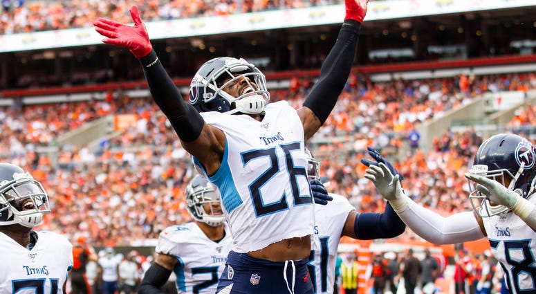 Tennessee Titans cornerback Logan Ryan (26) celebrates his interception against the Cleveland Browns during the fourth quarter at FirstEnergy Stadium.