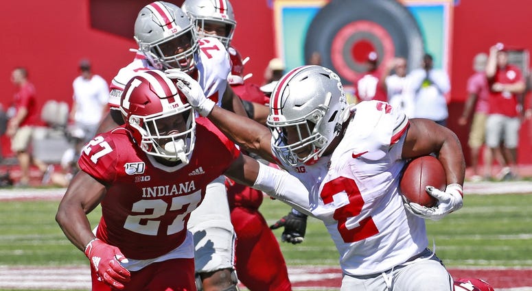 Ohio State Buckeyes running back J.K. Dobbins (2) breaks away to score a touchdown against Indiana Hoosiers defensive back Devon Matthews (27) during the second quarter at Memorial Stadium. Ohio State Buckeyes running back J.K. Dobbins (2) breaks away to score a touchdown against Indiana Hoosiers defensive back Devon Matthews (27) during the second quarter at Memorial Stadium.