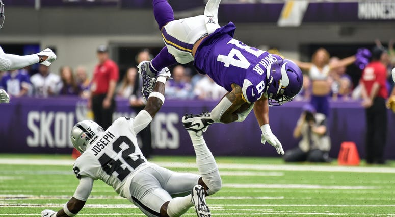 Minnesota Vikings tight end Irv Smith (84) is tackled by Oakland Raiders free safety Karl Joseph (42) during the first quarter at U.S. Bank Stadium. Cleveland Browns free safety Karl Joseph