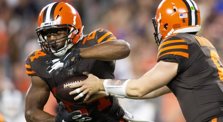Cleveland Browns quarterback Baker Mayfield (6) hands the ball off to running back Nick Chubb (24) during the first quarter against the Los Angeles Rams at FirstEnergy Stadium. Cleveland Browns quarterback Baker Mayfield (6) hands the ball off to running back Nick Chubb (24) during the first quarter against the Los Angeles Rams at FirstEnergy Stadium.