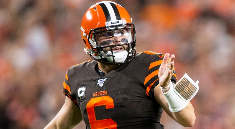 Caption: Sep 22, 2019; Cleveland, OH, USA; Cleveland Browns quarterback Baker Mayfield (6) signals to his receivers before the play against the Los Angeles Rams during the fourth quarter at FirstEnergy Stadium. The Rams won 20-13. Cleveland Browns quarterback Baker Mayfield