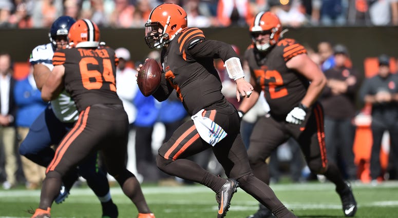 Cleveland Browns quarterback Baker Mayfield (6) runs for a touchdown during the first half against the Seattle Seahawks at FirstEnergy Stadium.