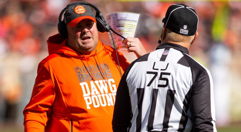 Cleveland Browns head coach Freddie Kitchens talks with side judge Rob Vernatchi (75) during the second quarter at FirstEnergy Stadium.