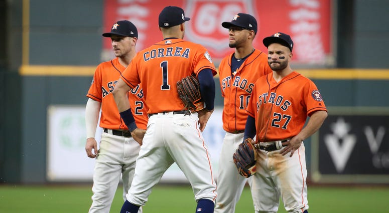 Houston Astros infielders Alex Bregman (2) , Carlos Correa (1), Yuli Gurriel (10) and Jose Altuve stand during a pitching change against the Washington Nationals during the eighth inning in game seven of the 2019 World Series at Minute Maid Park. Houston Astros infielders Alex Bregman (2) , Carlos Correa (1), Yuli Gurriel (10) and Jose Altuve stand during a pitching change against the Washington Nationals during the eighth inning in game seven of the 2019 World Series at Minute Maid Park.