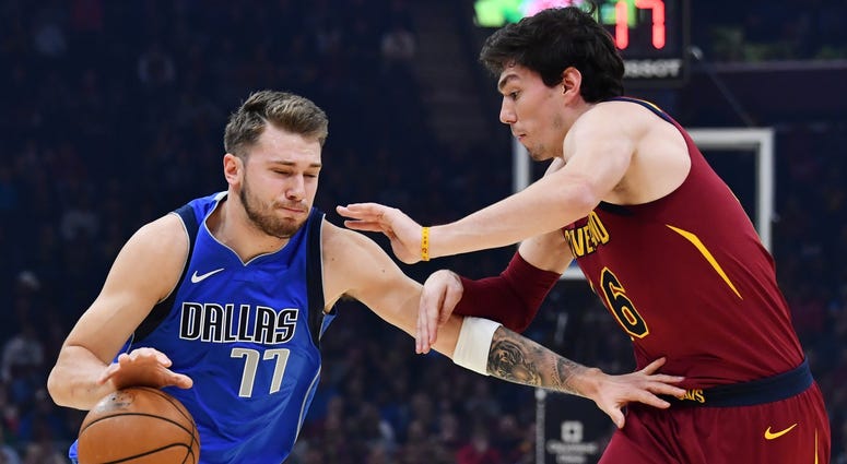 Nov 3, 2019; Cleveland, OH, USA; Dallas Mavericks guard Luka Doncic (77) drives to the basket against Cleveland Cavaliers forward Cedi Osman (16) during the first half at Rocket Mortgage FieldHouse. Mandatory Credit: Ken Blaze-USA TODAY Sports Nov 3, 2019; Cleveland, OH, USA; Dallas Mavericks guard Luka Doncic (77) drives to the basket against Cleveland Cavaliers forward Cedi Osman (16) during the first half at Rocket Mortgage FieldHouse. Mandatory Credit: Ken Blaze-USA TODAY Sports
