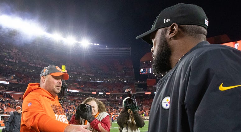 Nov 14, 2019; Cleveland, OH, USA; Cleveland Browns head coach Freddie Kitchens shakes hands with Pittsburgh Steelers head coach Mike Tomlin following a game at FirstEnergy Stadium. The Browns won 21-7. Cleveland Browns head coach Freddie Kitchens and Pittsburgh Steelers head coach Mike Tomlin