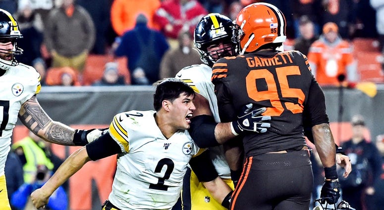 Nov 14, 2019; Cleveland, OH, USA; Cleveland Browns defensive end Myles Garrett (95) hits Pittsburgh Steelers quarterback Mason Rudolph (2) with his own helmet as offensive guard David DeCastro (66) tries to stop Garrett during the fourth quarter at FirstE Nov 14, 2019; Cleveland, OH, USA; Cleveland Browns defensive end Myles Garrett (95) hits Pittsburgh Steelers quarterback Mason Rudolph (2) with his own helmet as offensive guard David DeCastro (66) tries to stop Garrett during the fourth quarter at FirstE
