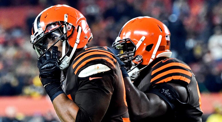 Nov 14, 2019; Cleveland, OH, USA; Cleveland Browns defensive end Myles Garrett (95) walks off the field after hitting Pittsburgh Steelers quarterback Mason Rudolph (2) with his own helmet during the fourth quarter at FirstEnergy Stadium. Cleveland Browns defensive end Myles Garrett (left)