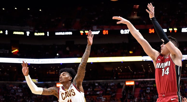 Nov 20, 2019; Miami, FL, USA; Miami Heat forward Duncan Robinson (55) shoots a three point basket over Cleveland Cavaliers guard Kevin Porter Jr. (4) during the first half at American Airlines Arena. Miami Heat forward Duncan Robinson (55) shoots a three point basket over Cleveland Cavaliers guard Kevin Porter Jr. (4)
