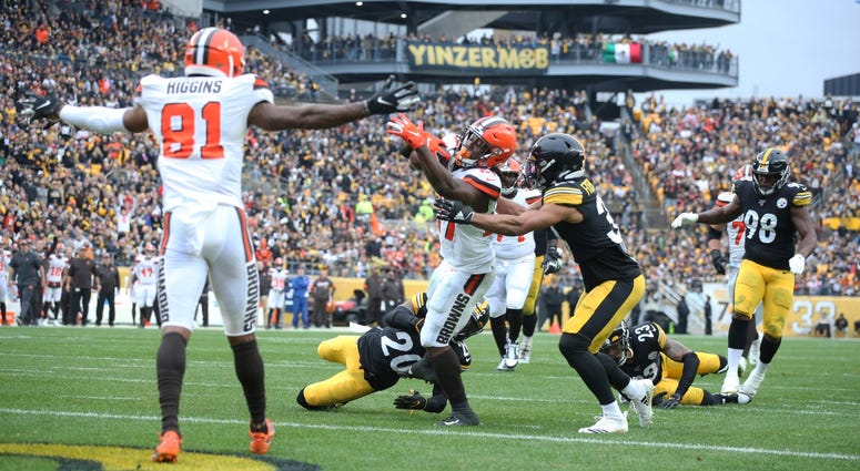 Dec 1, 2019; Pittsburgh, PA, USA; Cleveland Browns running back Kareem Hunt (27) scores a touchdown past Pittsburgh Steelers cornerback Cameron Sutton (20) and free safety Minkah Fitzpatrick (39) during the second quarter at Heinz Field. Mandatory Credit: Dec 1, 2019; Pittsburgh, PA, USA; Cleveland Browns running back Kareem Hunt (27) scores a touchdown past Pittsburgh Steelers cornerback Cameron Sutton (20) and free safety Minkah Fitzpatrick (39) during the second quarter at Heinz Field. Mandatory Credit:
