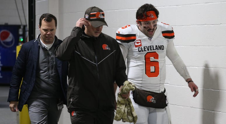 Dec 1, 2019; Pittsburgh, PA, USA; Cleveland Browns quarterback Baker Mayfield (6) returns to the locker room early after suffering an apparent injury to his hand against the Pittsburgh Steelers late in the second quarter at Heinz Field. Mandatory Credit: Dec 1, 2019; Pittsburgh, PA, USA; Cleveland Browns quarterback Baker Mayfield (6) returns to the locker room early after suffering an apparent injury to his hand against the Pittsburgh Steelers late in the second quarter at Heinz Field. Mandatory Credit: