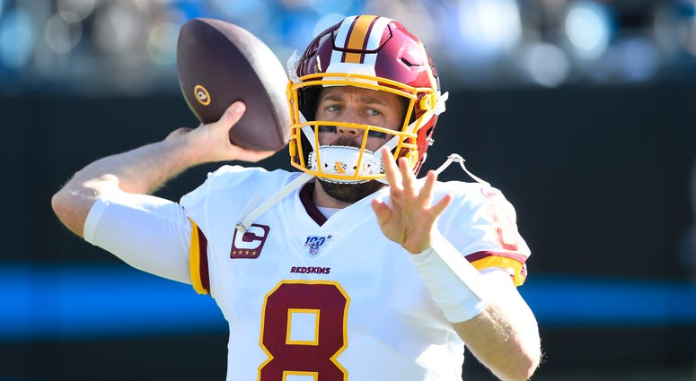 Washington Redskins quarterback Case Keenum (8) warms up in the second quarter at Bank of America Stadium. Washington Redskins quarterback Case Keenum (8) warms up in the second quarter at Bank of America Stadium.