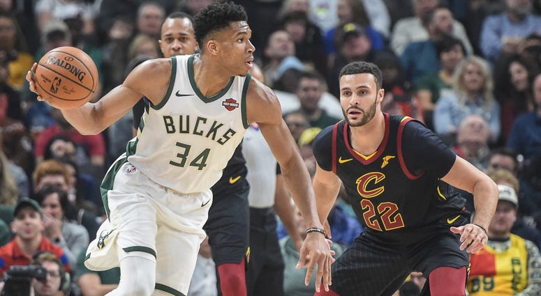 Dec 14, 2019; Milwaukee, WI, USA; Milwaukee Bucks forward Giannis Antetokounmpo (34) drives for the basket against Cleveland Cavaliers forward Larry Nance Jr. (22) in the second quarter at Fiserv Forum. Milwaukee Bucks forward Giannis Antetokounmpo (34) drives for the basket against Cleveland Cavaliers forward Larry Nance Jr. (22)