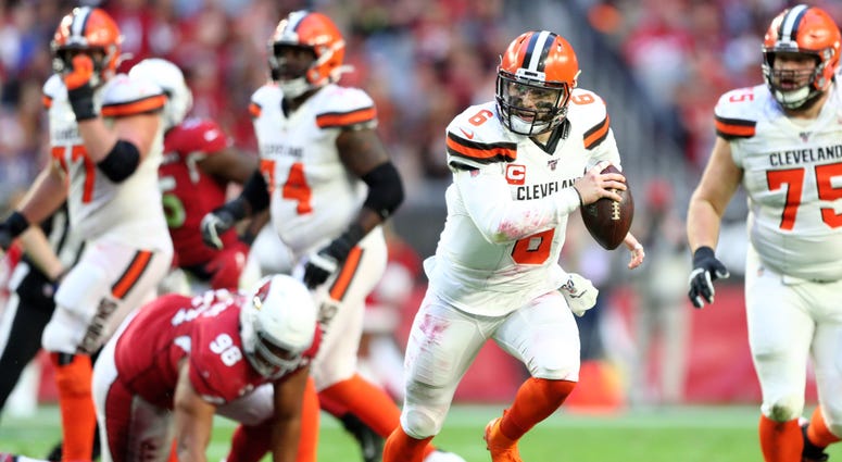 Cleveland Browns quarterback Baker Mayfield (6) runs the ball against the Arizona Cardinals at State Farm Stadium. Cleveland Browns quarterback Baker Mayfield (6) runs the ball against the Arizona Cardinals at State Farm Stadium.