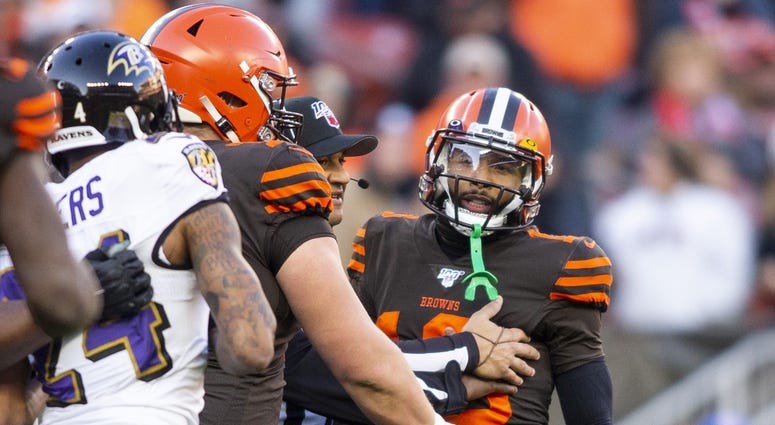 Cleveland Browns wide receiver Odell Beckham (13) is held back as he exchanges words with Baltimore Ravens cornerback Marcus Peters (24) during the fourth quarter at FirstEnergy Stadium. Cleveland Browns wide receiver Odell Beckham (13) is held back as he exchanges words with Baltimore Ravens cornerback Marcus Peters (24) during the fourth quarter at FirstEnergy Stadium.