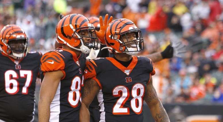 Dec 29, 2019; Cincinnati, Ohio, USA; Cincinnati Bengals running back Joe Mixon (28) reacts with wide receiver Tyler Boyd (83) after scoring touchdown against the Cleveland Browns during the second half at Paul Brown Stadium. Mandatory Credit: David Kohl-U Dec 29, 2019; Cincinnati, Ohio, USA; Cincinnati Bengals running back Joe Mixon (28) reacts with wide receiver Tyler Boyd (83) after scoring touchdown against the Cleveland Browns during the second half at Paul Brown Stadium. Mandatory Credit: David Kohl-U