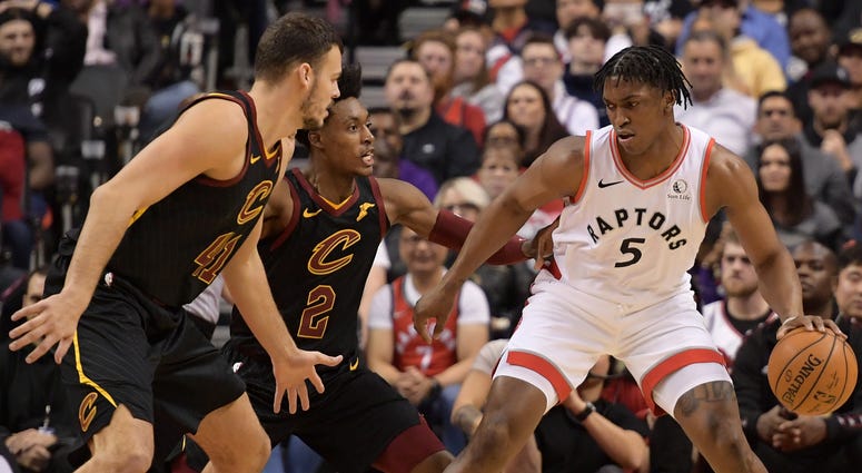 Dec 31, 2019; Toronto, Ontario, CAN; Toronto Raptors forward Stanley Johnson (5) controls the ball as Cleveland Cavaliers guard Collin Sexton (2) and center Ante Zizic (41) defend in the second half at Scotiabank Arena. Dec 31, 2019; Toronto, Ontario, CAN; Toronto Raptors forward Stanley Johnson (5) controls the ball as Cleveland Cavaliers guard Collin Sexton (2) and center Ante Zizic (41) defend