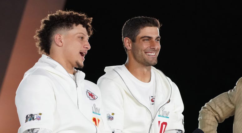 Jan 27, 2020; Miami, FL, USA; Kansas City Chiefs quarterback Patrick Mahomes (left) and San Francisco 49ers quarterback Jimmy Garoppolo (right) are interviewed on stage during Super Bowl LIV Opening Night at Marlins Park. Kansas City Chiefs quarterback Patrick Mahomes (left) and San Francisco 49ers quarterback Jimmy Garoppolo (right)