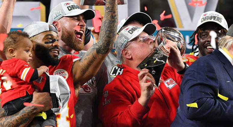 Kansas City Chiefs head coach Andy Reid hoist the Vince Lombardi Trophy after defeating the San Francisco 49ers in Super Bowl LIV at Hard Rock Stadium. Andy Reid Kansas City Chiefs Super Bowl LIV champions