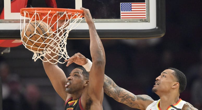 Feb 12, 2020; Cleveland, Ohio, USA; Cleveland Cavaliers center Tristan Thompson (13) dunks beside Atlanta Hawks forward John Collins (20) in the second quarter at Rocket Mortgage FieldHouse. Mandatory Credit: David Richard-USA TODAY Sports Feb 12, 2020; Cleveland, Ohio, USA; Cleveland Cavaliers center Tristan Thompson (13) dunks beside Atlanta Hawks forward John Collins (20) in the second quarter at Rocket Mortgage FieldHouse. Mandatory Credit: David Richard-USA TODAY Sports
