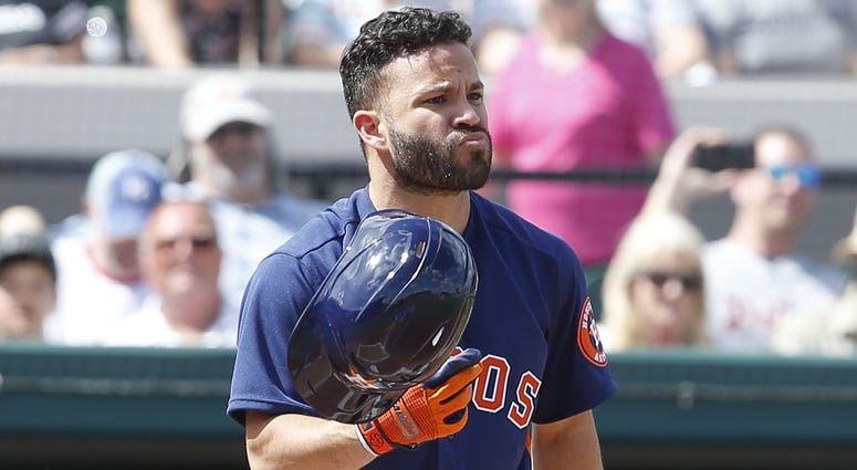 Houston Astros second baseman Jose Altuve (27) recovers his helmet after it fell off on a swing during the first inning against the Detroit Tigers at Publix Field at Joker Marchant Stadium. Houston Astros second baseman Jose Altuve (27) recovers his helmet after it fell off on a swing during the first inning against the Detroit Tigers at Publix Field at Joker Marchant Stadium.