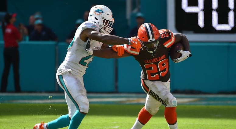 Sep 25, 2016; Miami Gardens, FL, USA; Cleveland Browns running back Duke Johnson (29) stiff arms Miami Dolphins cornerback Xavien Howard (25) during the second half at Hard Rock Stadium.The Miami Dolphins defeat the Cleveland Browns 34-20 in overtime. Man Sep 25, 2016; Miami Gardens, FL, USA; Cleveland Browns running back Duke Johnson (29) stiff arms Miami Dolphins cornerback Xavien Howard (25) during the second half at Hard Rock Stadium.The Miami Dolphins defeat the Cleveland Browns 34-20 in overtime. Man