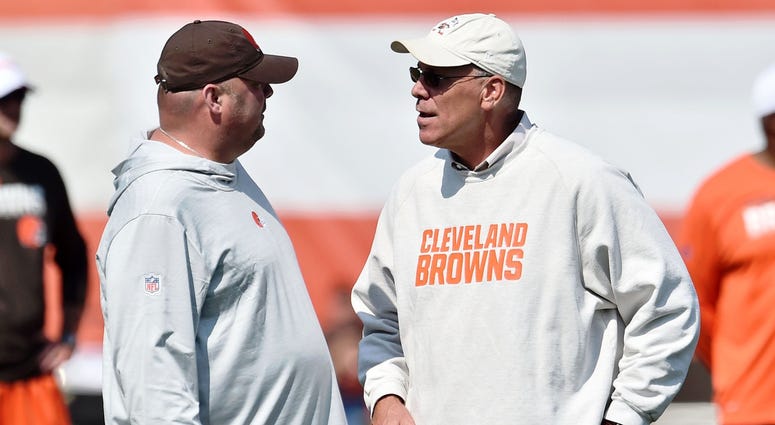 Jul 26, 2019; Berea, OH, USA; Cleveland Browns head coach Freddie Kitchens (left) talks with general manager John Dorsey during training camp at the Cleveland Browns Training Complex. Cleveland Browns head coach Freddie Kitchens (left) talks with general manager John Dorsey
