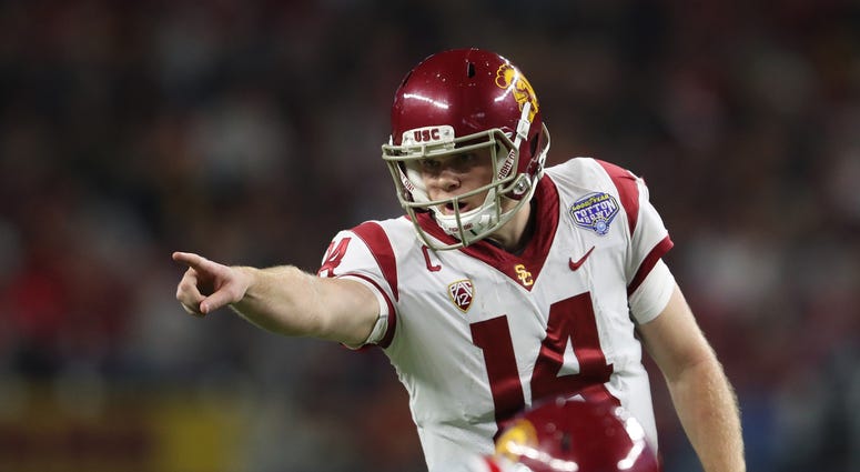 Dec 29, 2017; Arlington, TX, USA; Southern California Trojans quarterback Sam Darnold (14) signals prior to the snap of the ball against the Ohio State Buckeyes in the 2017 Cotton Bowl at AT&T Stadium. Mandatory Credit: Matthew Emmons-USA TODAY Sports
