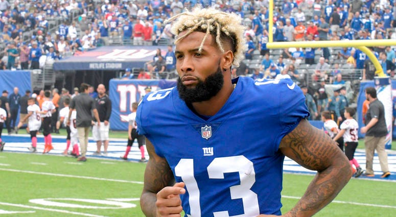 FILE - In this Oct. 8, 2017, file photo, New York Giants wide receiver Odell Beckham warms up prior to an NFL football game against the Los Angeles Chargers, in East Rutherford, N.J. The Giants have opened their first organized team activities under new c FILE - In this Oct. 8, 2017, file photo, New York Giants wide receiver Odell Beckham warms up prior to an NFL football game against the Los Angeles Chargers, in East Rutherford, N.J. The Giants have opened their first organized team activities under new c